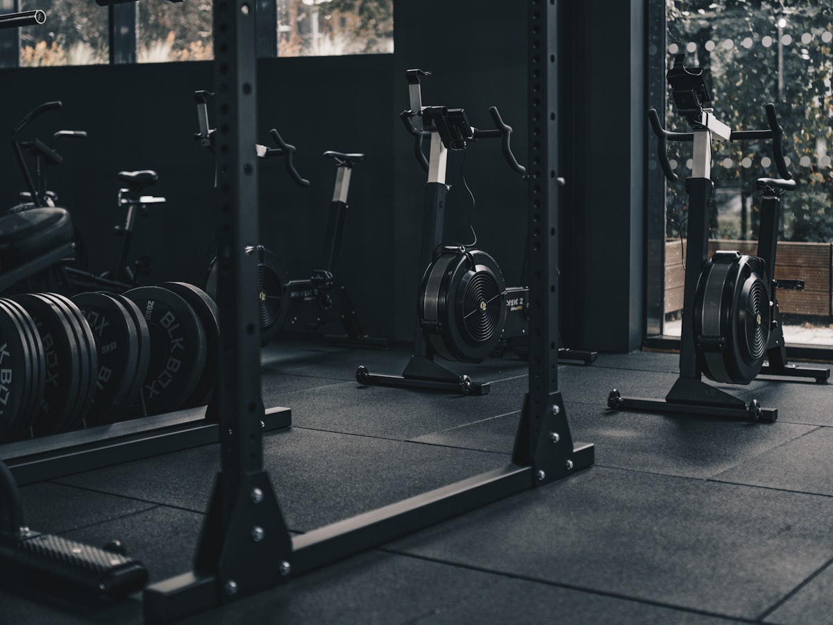 Row of strength training equipment on a gym floor